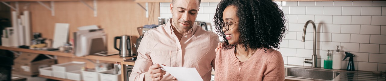 couple looking into a document